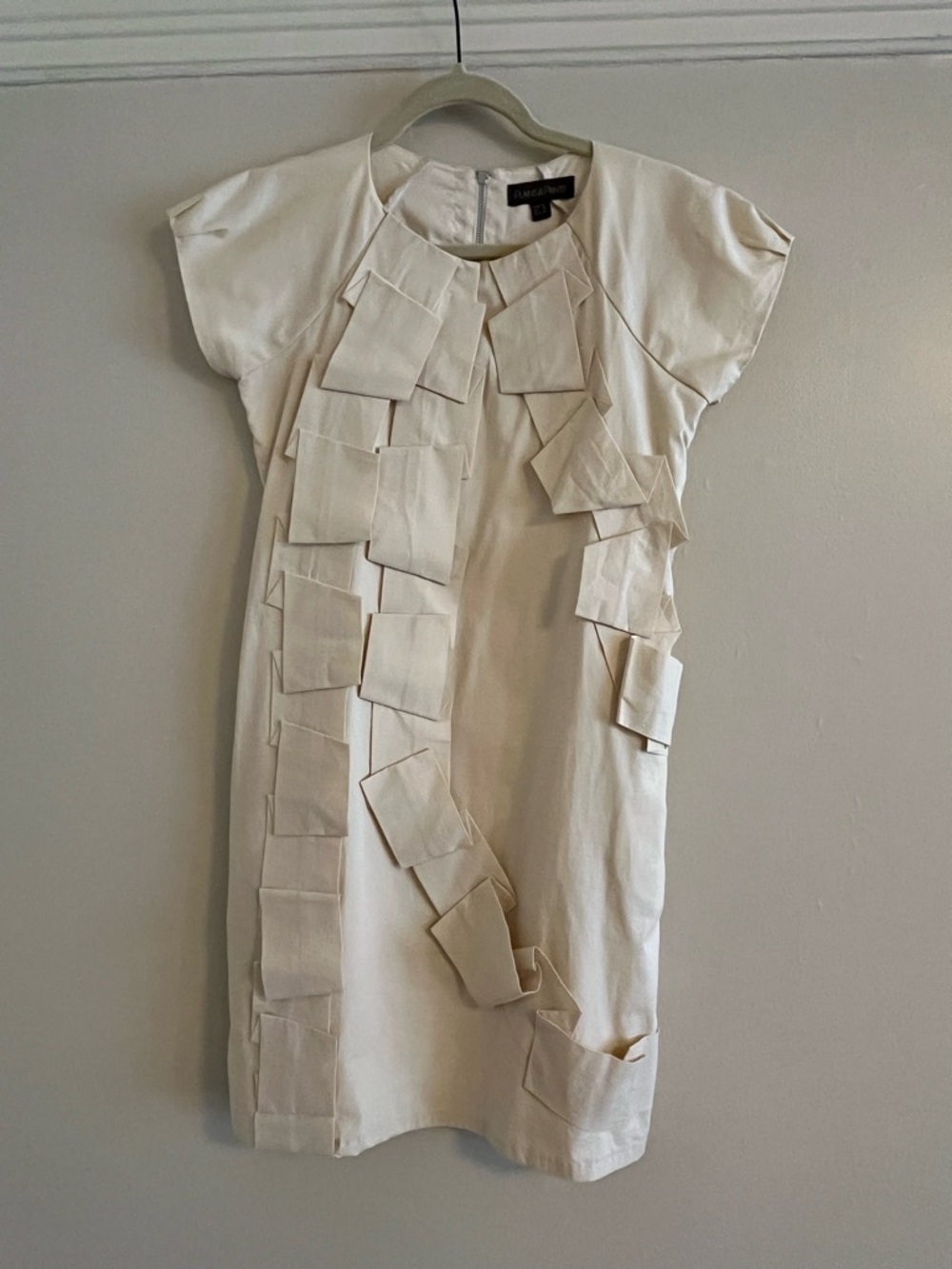 Plains & Prints Cream Short Sleeve Mini Dress with Layered Tab Detail.